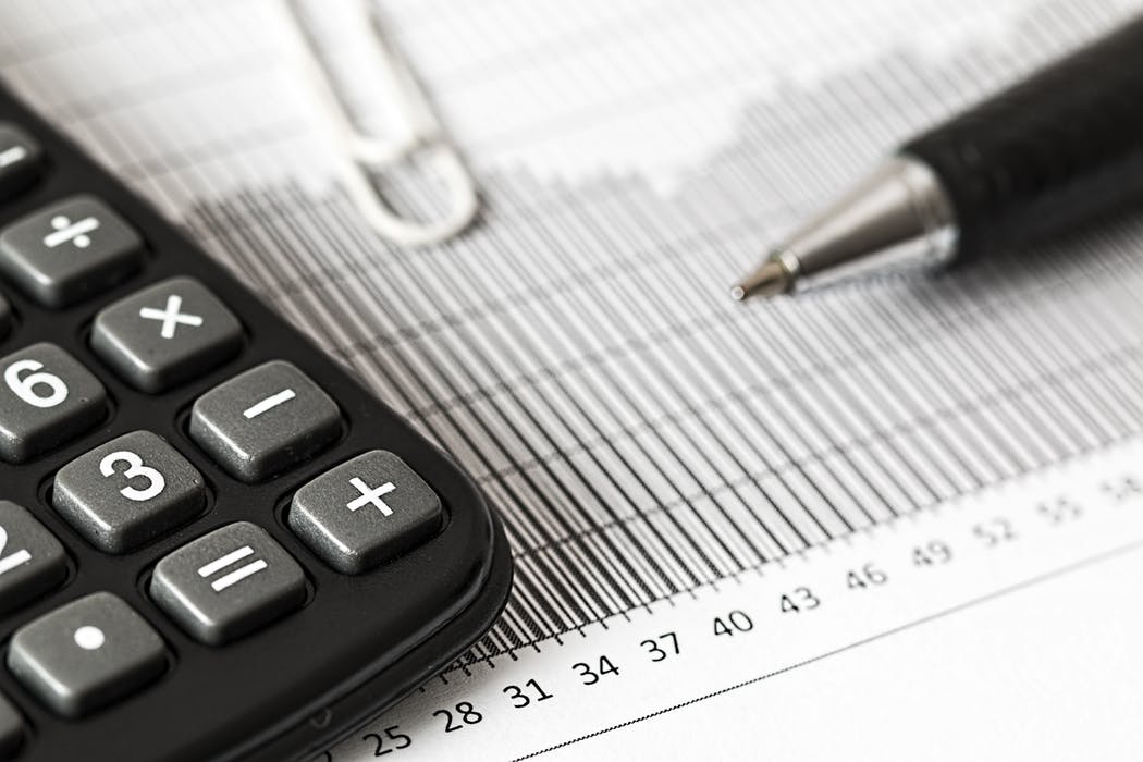 Tax Accountant's calculator and balance sheets