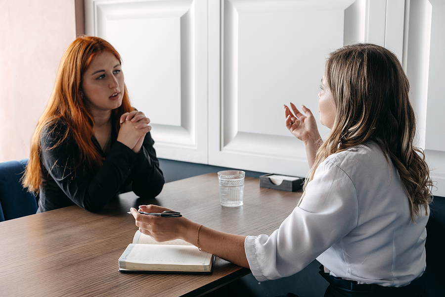 Woman meeting a holistic therapist to cope with emotional difficulties