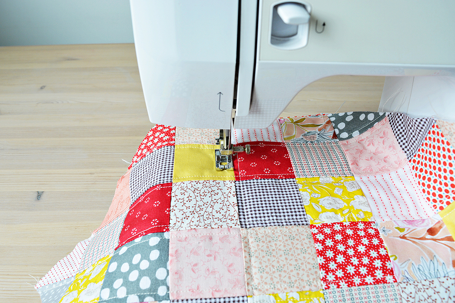 Quilting process. Quilt and a sewing machine