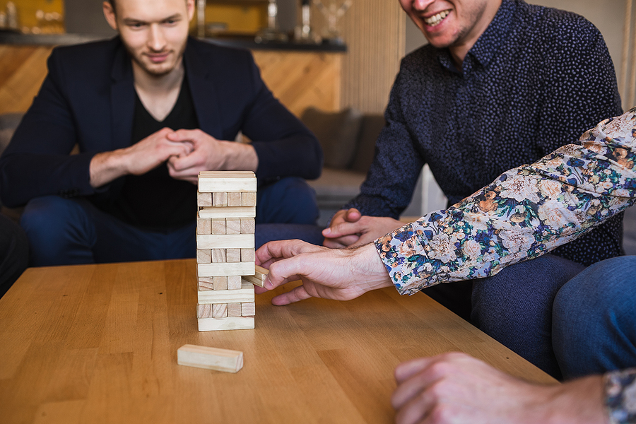 Group of employees playing board games during team building events