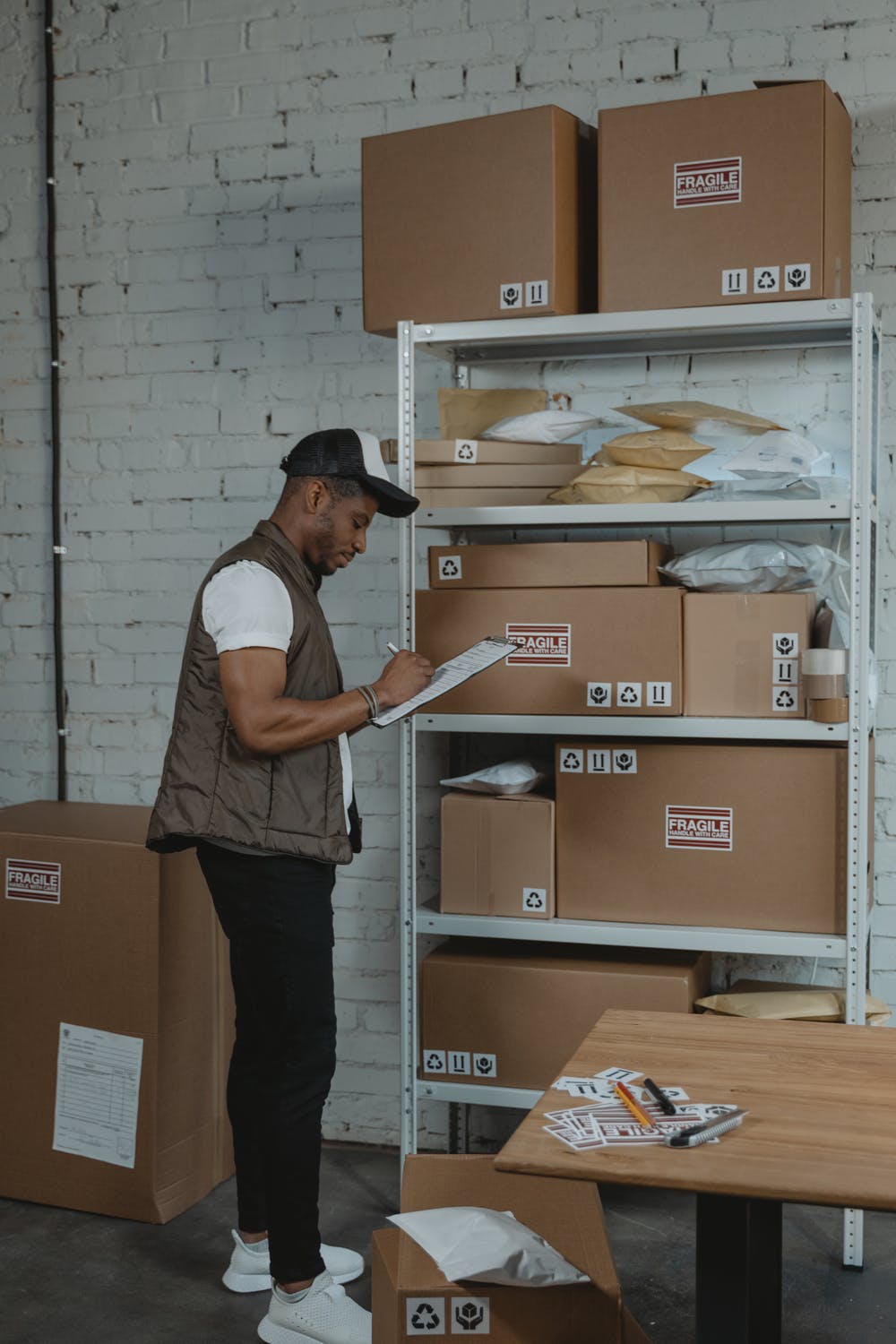 Male worker doing inventory inside a 3PL warehouse
